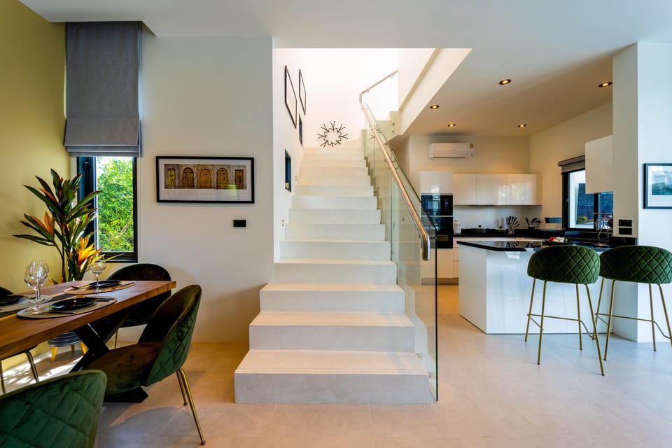 Exclusive Villa | Living area | 50-inch flat-screen TV with digital channels