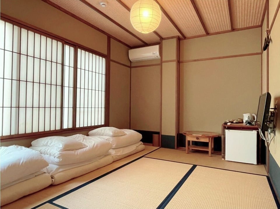Triple Room with Private Bathroom (2,3 persons), Non Smoking | Iron/ironing board, free WiFi, bed sheets