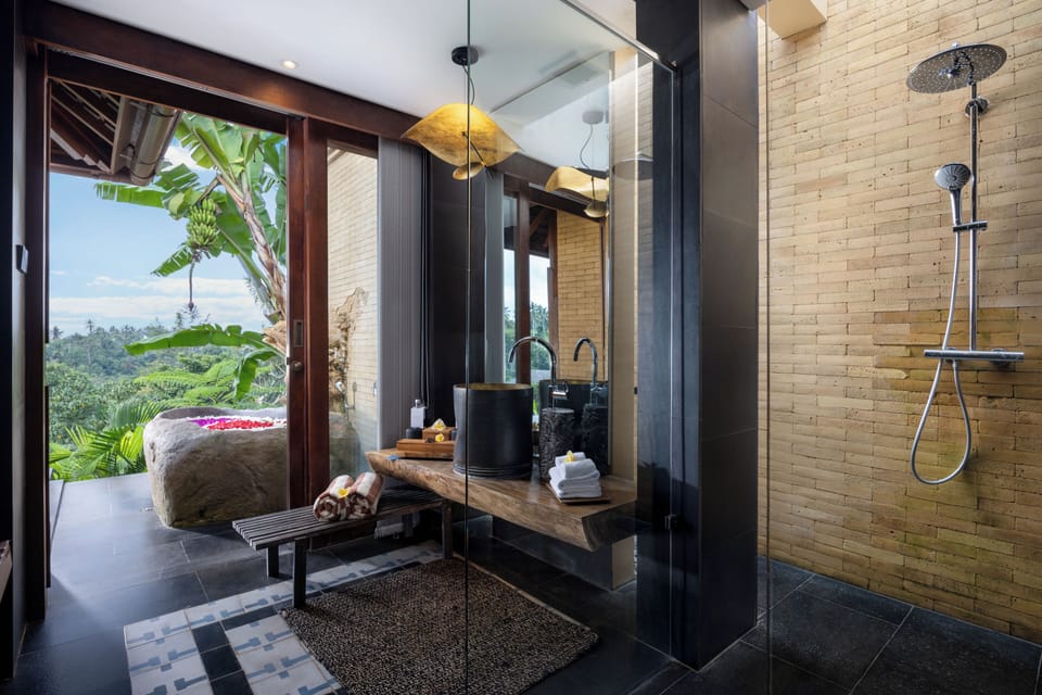 Separate tub and shower, rainfall showerhead, free toiletries