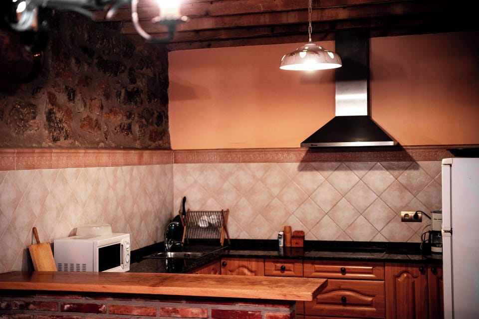 Family Apartment, Mountain View | Private kitchen | Microwave, highchair