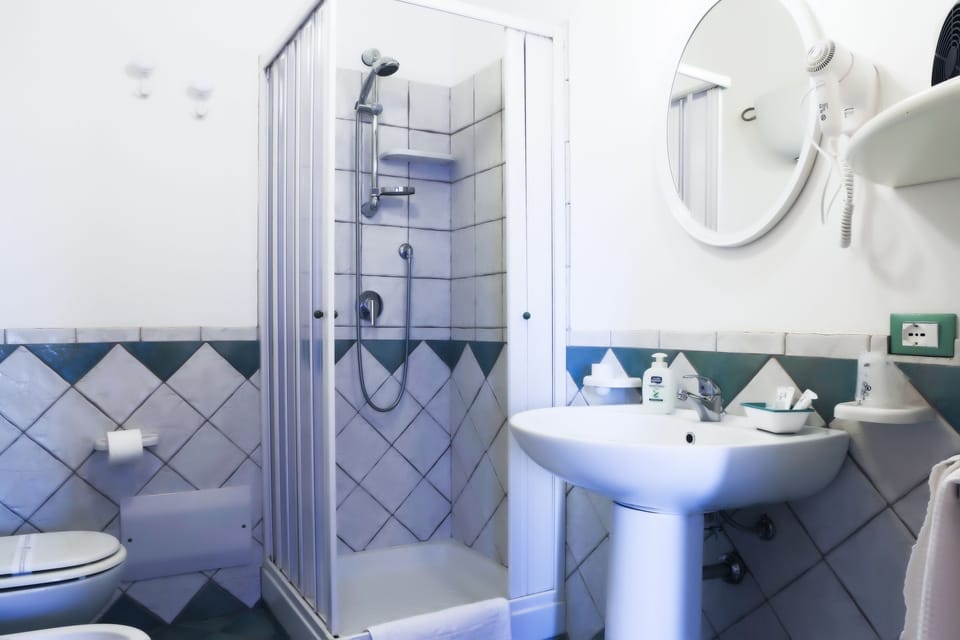 Triple Room, Garden View | Bathroom | Shower, free toiletries, hair dryer, bidet