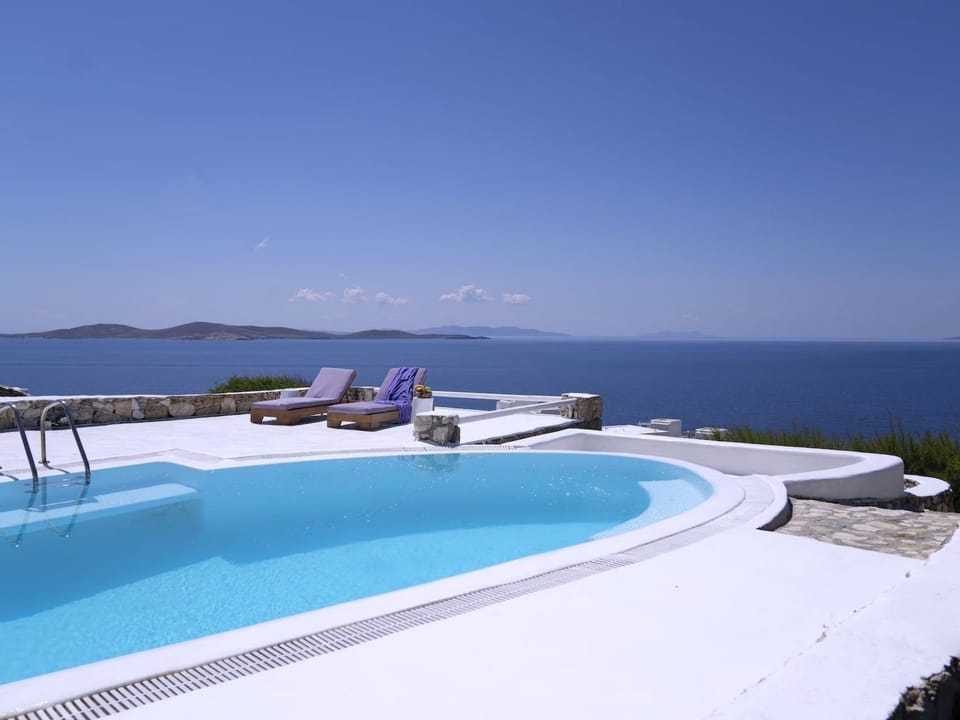 SUPERB BEACH ACCESS LUXURY SEA VILLA POOL by Calypso Sunset Vacation rental in Mykonos, Mikonos 846 00, Greece