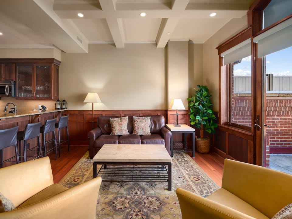 The bright living room has a couch that pulls out to sleep 2.
