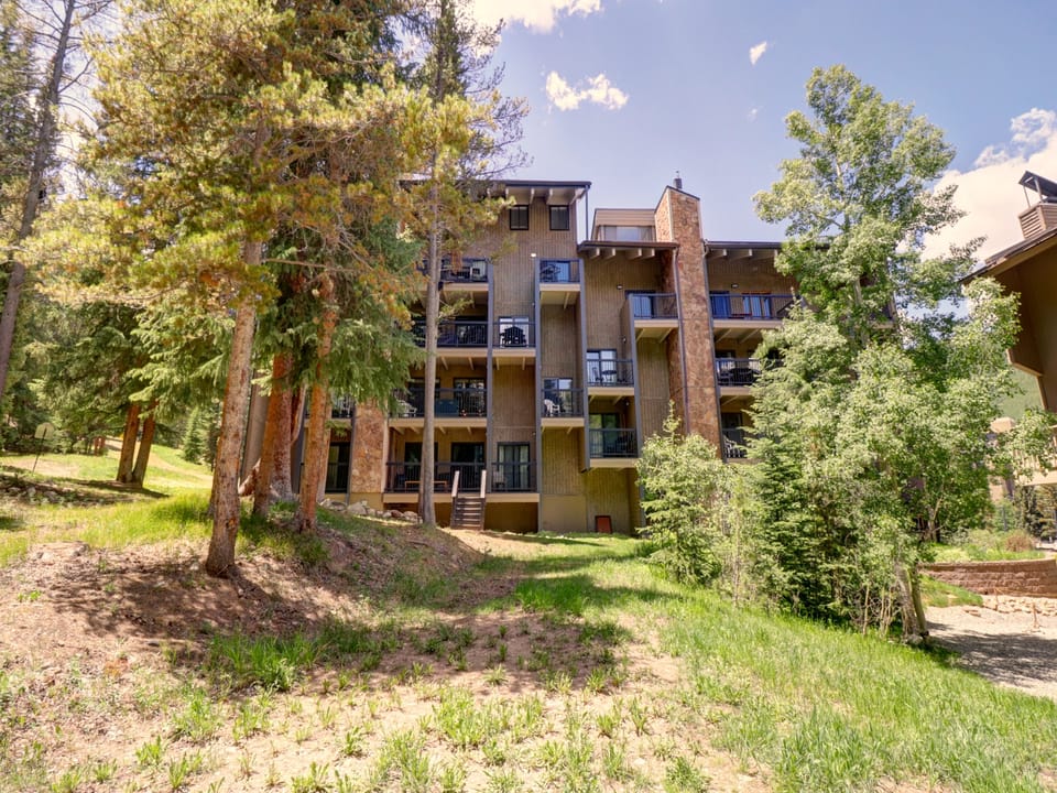 East side of building with views of trees.