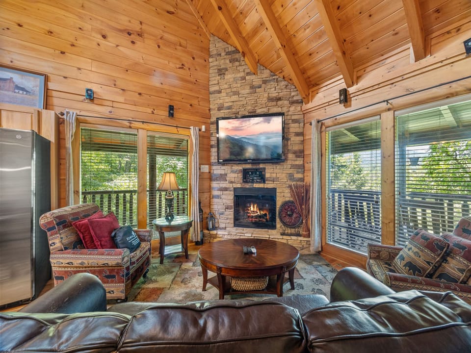 Living Room with soaring ceilings and stone fireplace.