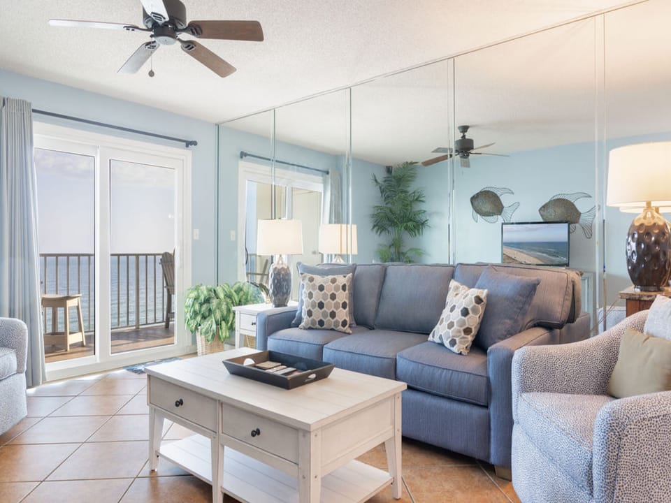 The inviting living area features a stylish sofa sleeper, perfect for accommodating additional overnight guests, alongside thoughtfully curated furnishings that ensure comfort and relaxation.
