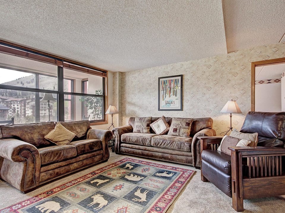 Living room features a couch that pulls out into a queen size sleeper sofa