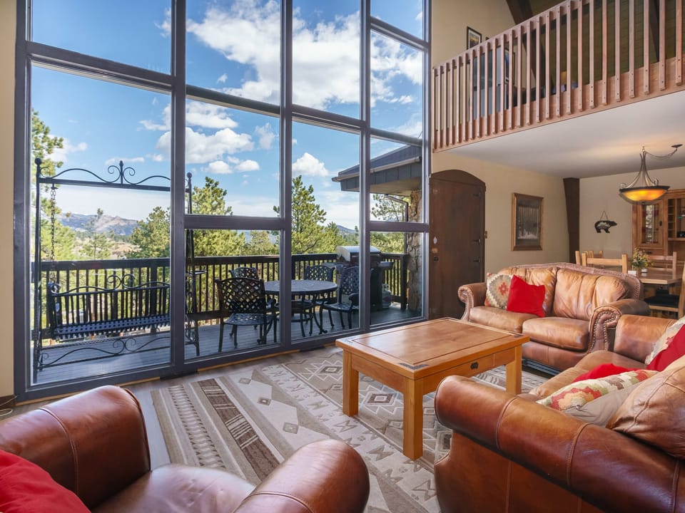 Sky View in the Rockies - Open concept floor plan with cathedral ceiling and floor to ceiling windows.