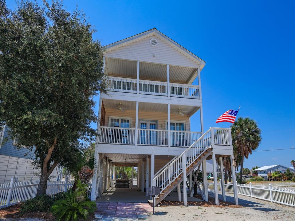 Coast A While is a 4 Bedroom, 3 & 1/2  bathroom home located off West Beach in Gulf Shores.