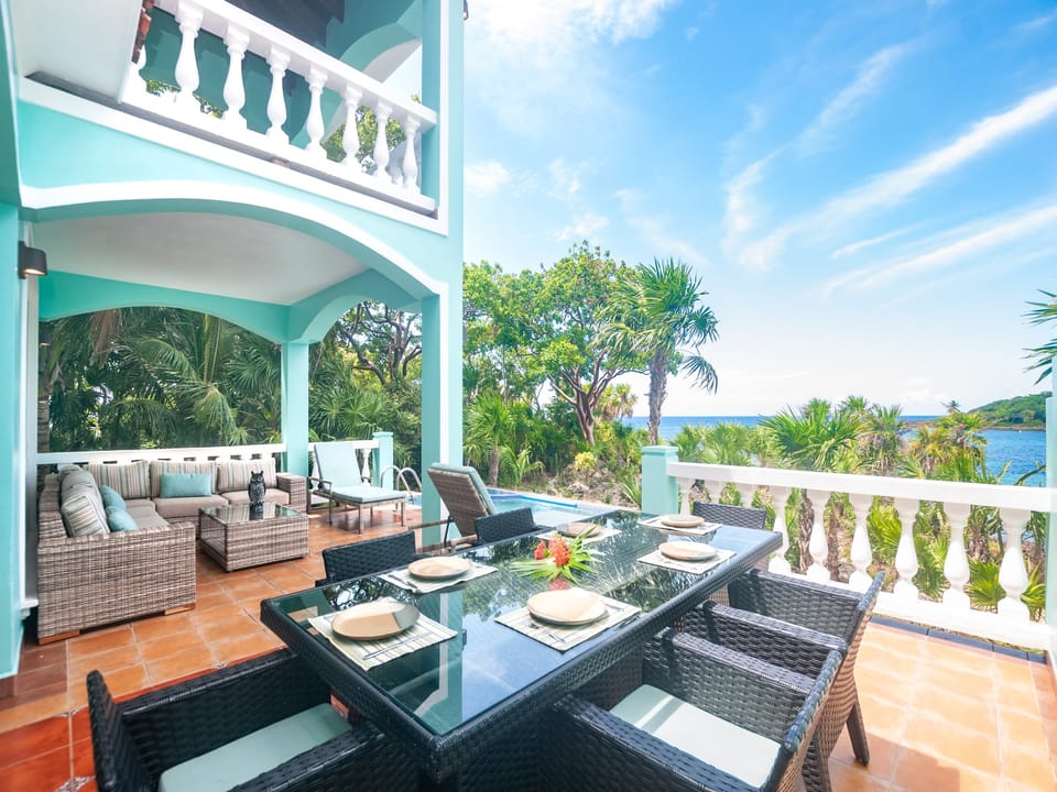 The private back patio with dining area, private pool and grill