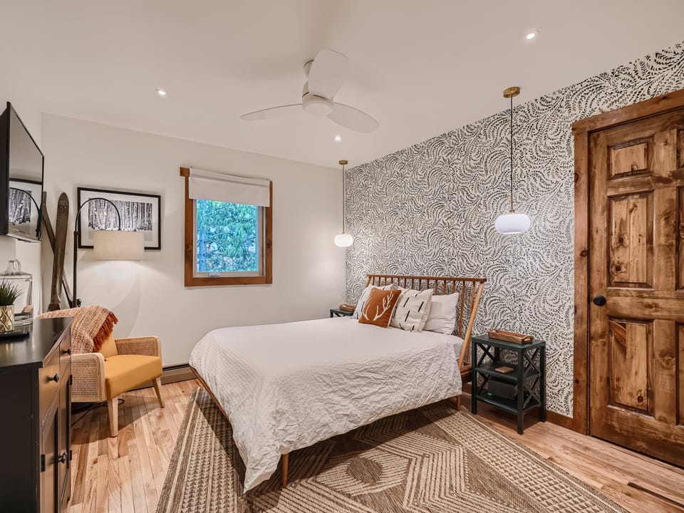 Queen bedroom with walk-in closet and work from home station