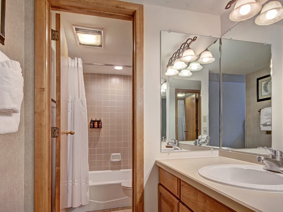 Full bathroom with a door to close off toilet/shower area.