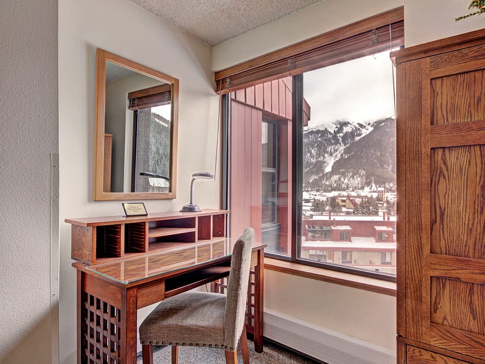 Desk seating area near window, with great mountain views.