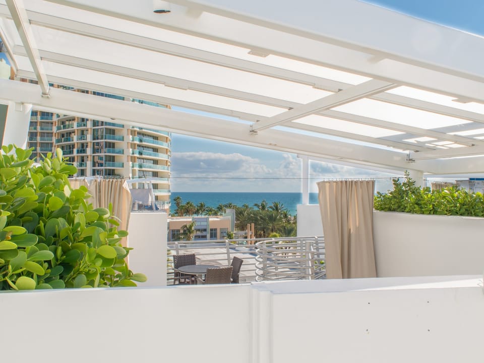 Partial ocean view while standing on the hot tub deck
