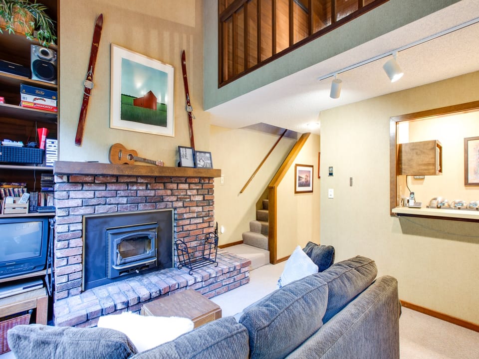 Living room with cozy wood burning fireplace