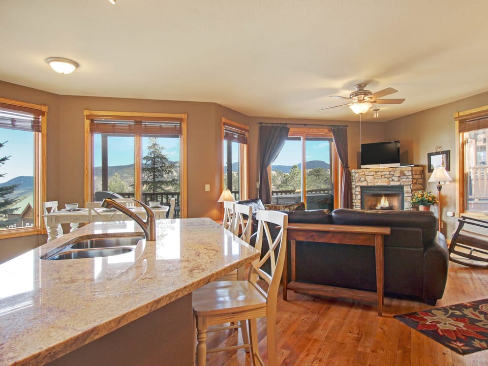 Sheep Mountain 20B - Open concept living room/kitchen with breakfast bar, dining area, fireplace and flat screen TV