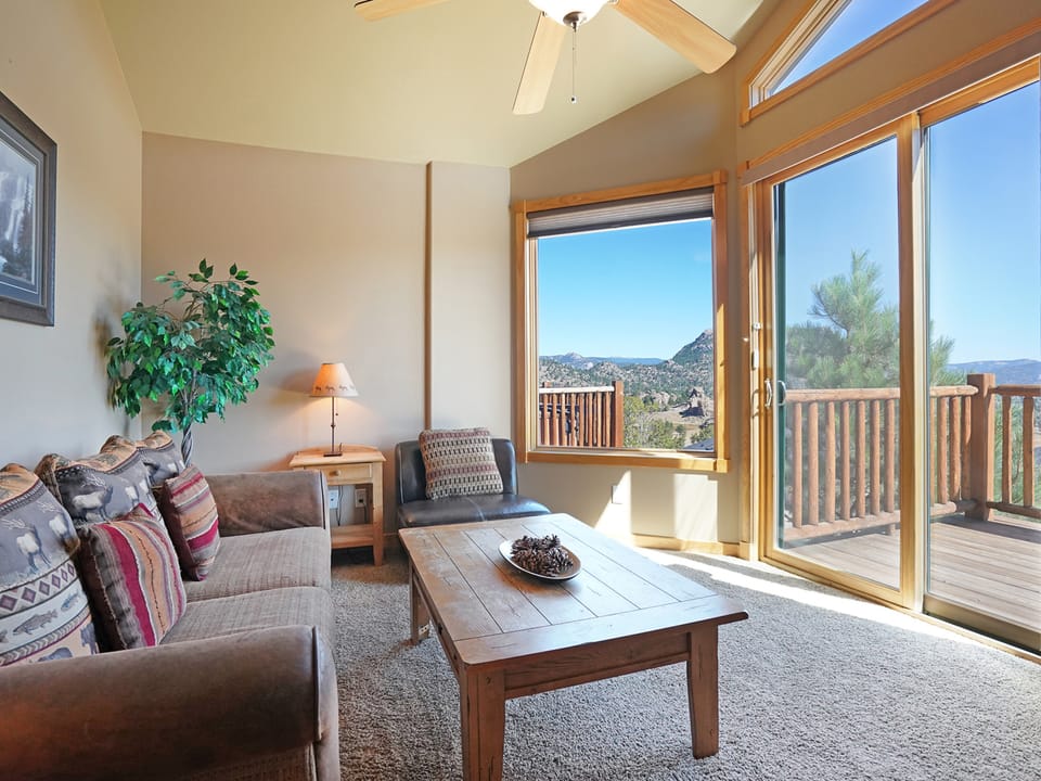 Teepee Mountain 12A - Enjoy the picturesque views from the comfy queen sleeper sofa or leather chair.
