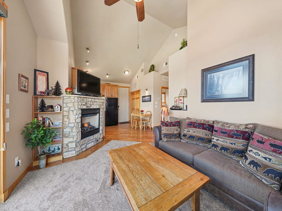 Cozy up in this inviting living area with stone fireplace, a perfect mountain getaway. The queen sleeper sofa provides extra sleeping space for the kids.