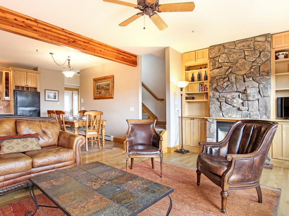 Mount Chapin S4 - Beautiful stone, gas fireplace in the main living space. Comfortable sofa and recliner seating.