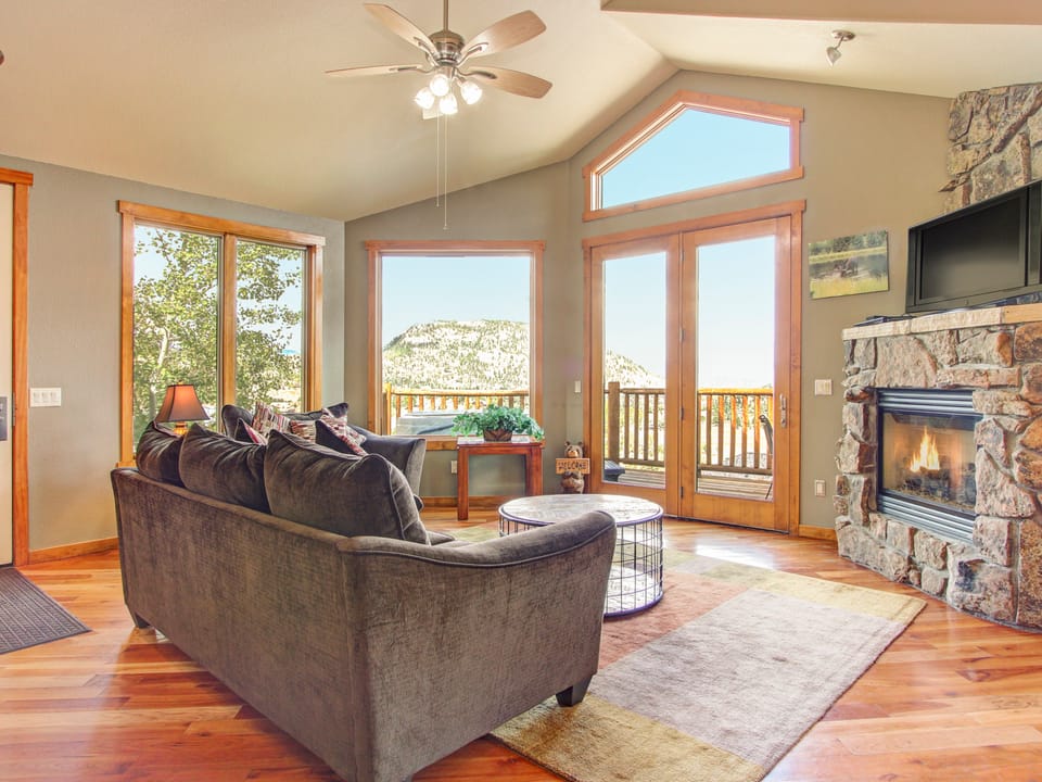 Mount Cairns 16A - The living room offers a gas fireplace, queen sleeper sofa, comfy seating and a flat screen TV, and of course magnificent views.