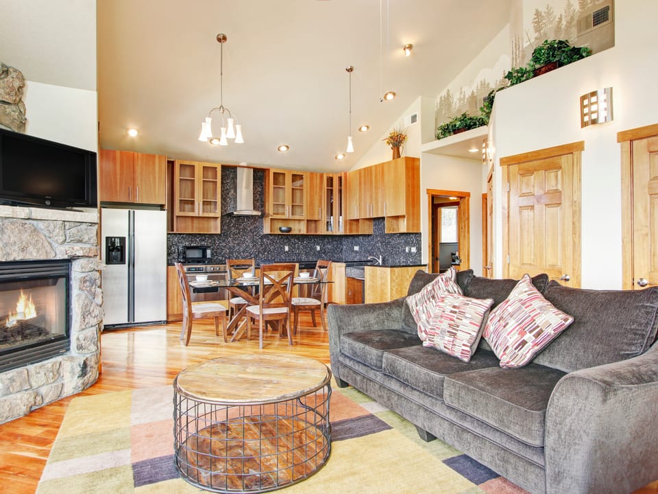 Mount Cairns 16A - Open concept living room/kitchen with vaulted ceiling. With queen sleeper sofa, fireplace and flat screen TV