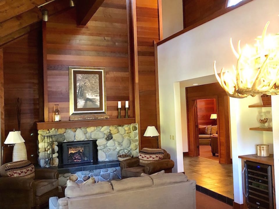 Spacious, warm and inviting with cathedral ceilings, gas fireplace, comfortable fine furnishings, mini bar with wine refrigerator, and serene, peaceful views of golf course.