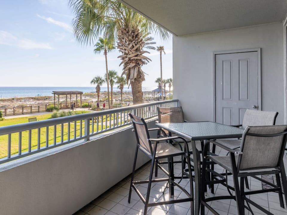 The spacious balcony features a table with seating for 4, and is a great space for enjoying meals or your morning cup of coffee.