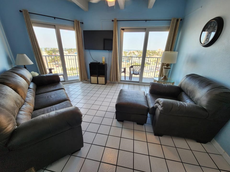 Living room provides access to private balcony.