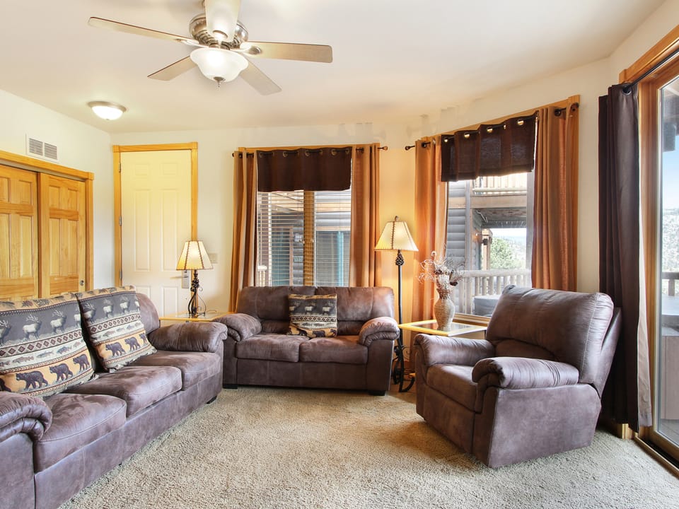 Chiefs Head Peak 21B - Comfortable seating in living area with a queen sleeper sofa, loveseat and oversized chair.
