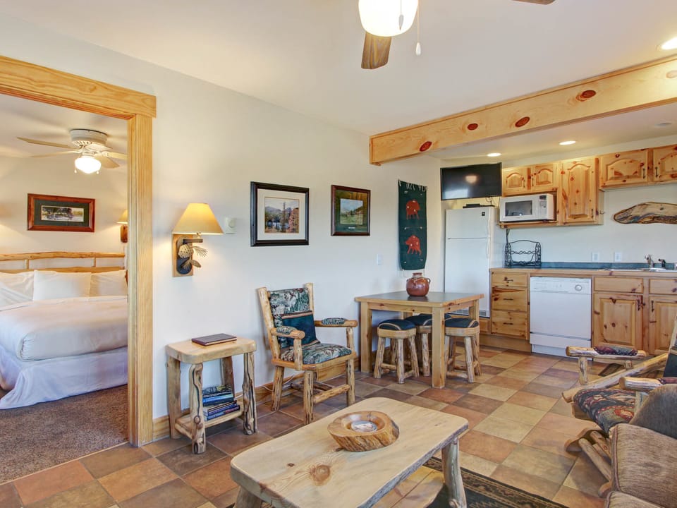 Ptarmigan Mountain 202 - Open concept living/kitchen/dining area. Beautiful rustic log touches.