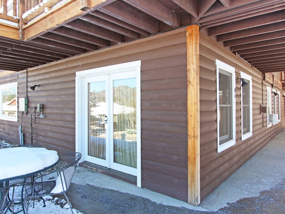 Little Matterhorn 17A - The entrance is located on the lower level of the old lodge guesthouse, featuring a patio where guests can enjoy the fresh mountain air and beautiful views.