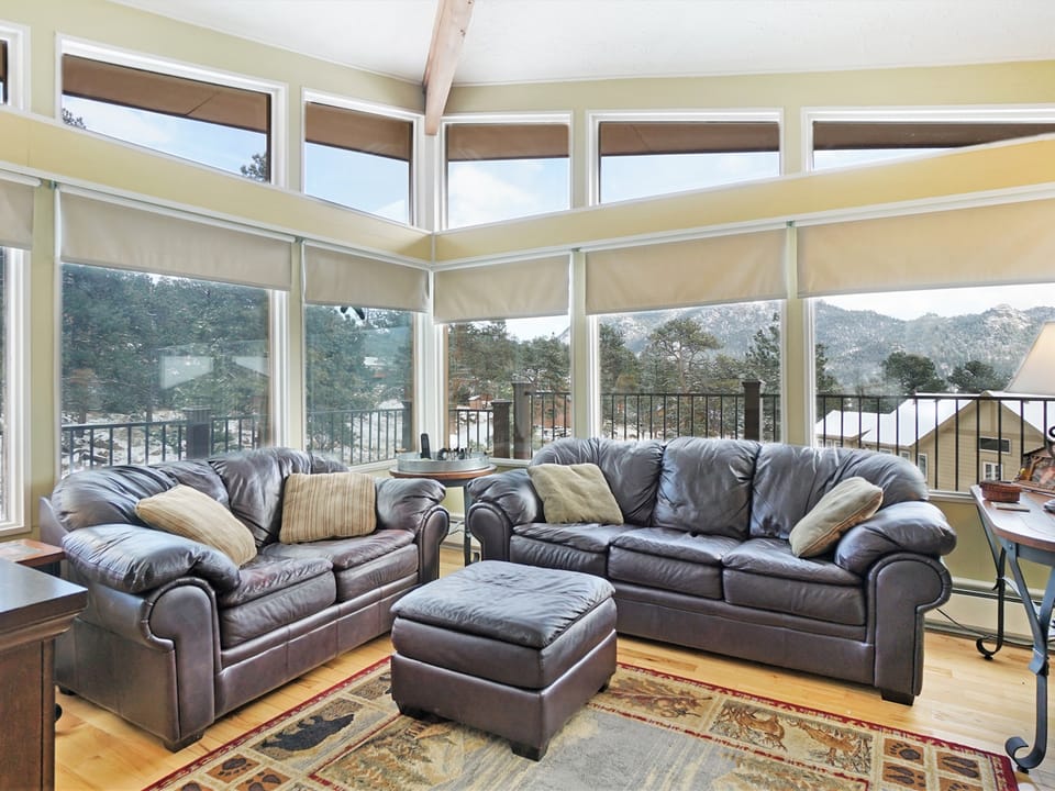 Starlight in the Rockies - Living room with a couch, love seat, ottoman, rocking chair and spectacular views