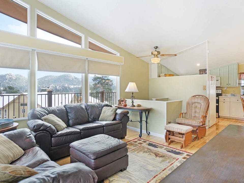 Starlight in the Rockies - Living room with a couch, love seat, ottoman and rocking chair