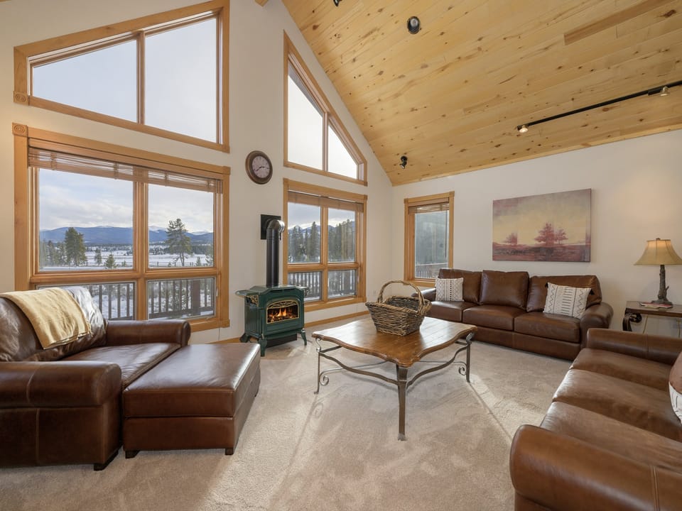 Cozy Living Room with Fireplace and NEW Pottery barn furniture, large windows with views