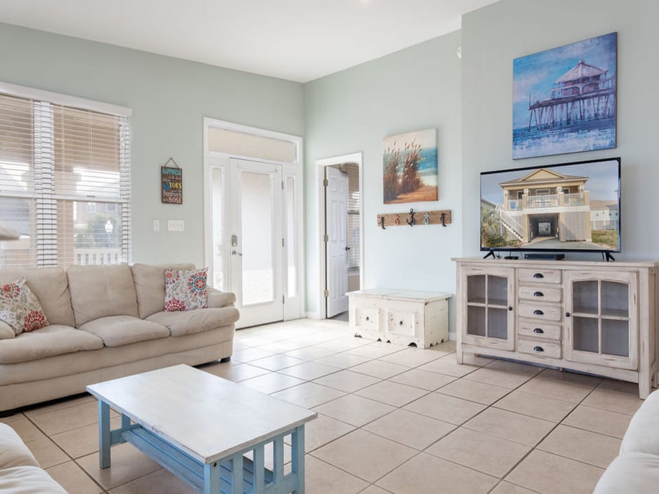 This spacious living area features plenty of comfortable seating and a large television for relaxing and enjoying your down time.