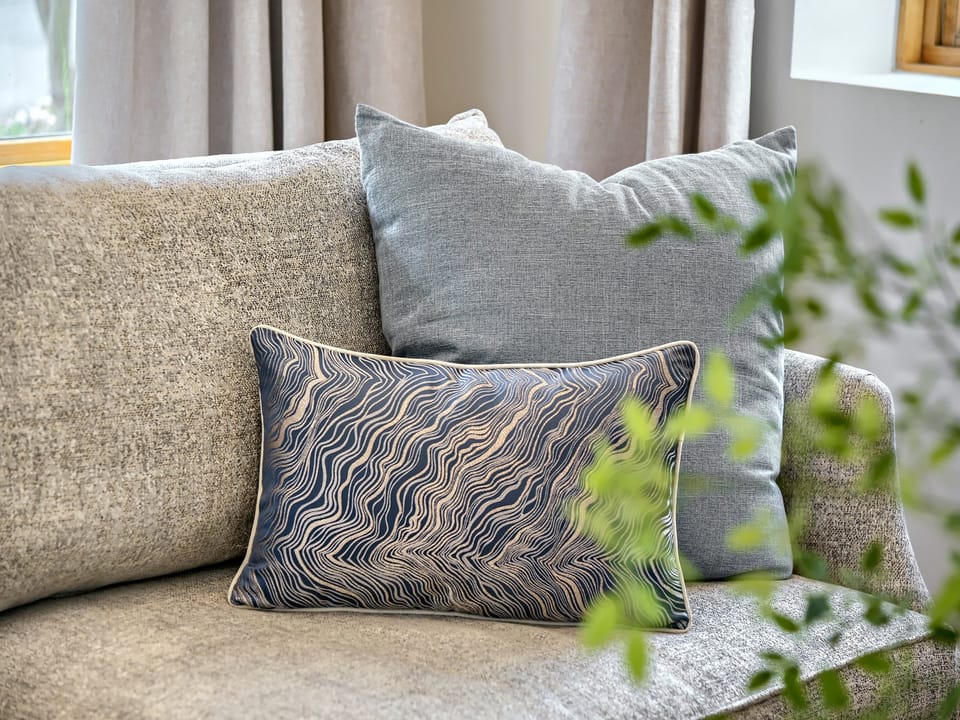 Sink into plush comfort on this inviting sofa, where soft textures and stylish cushions create your perfect spot to unwind after exploring.