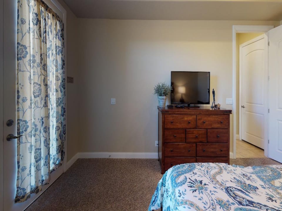 Master suite featuring large flat screen tv