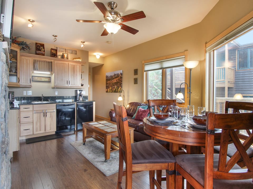 Deer Mountain 28B - Bar-height table with seating for four in the living/dining area, adjacent to the efficiency kitchen.