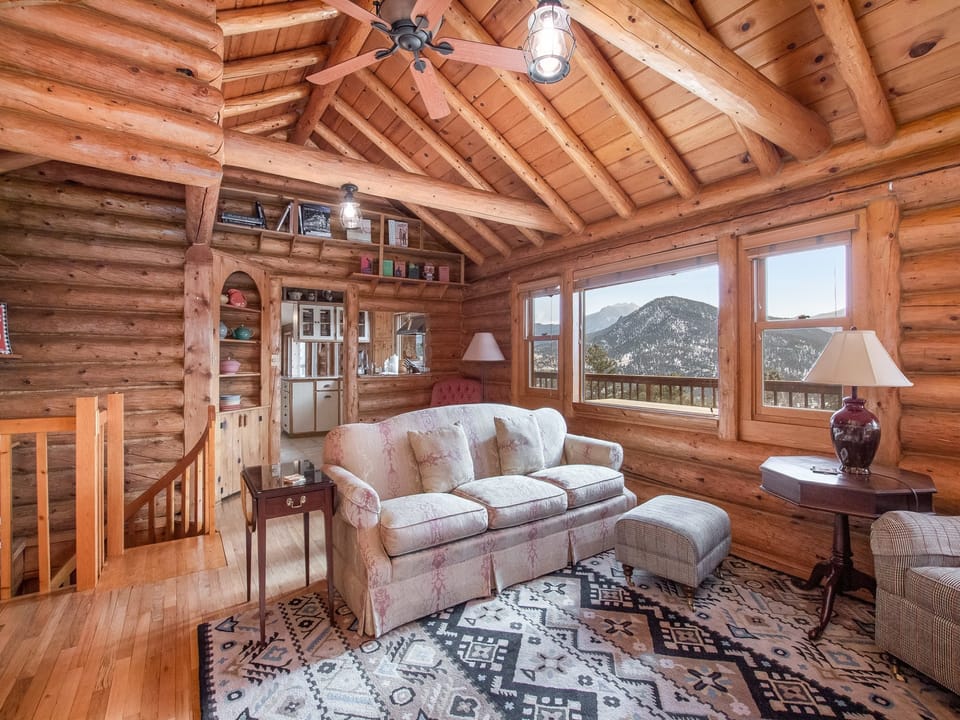 Bishop's Retreat - Roosevelt room has magnificent mountain views, comfortable seating. Fireplace not operable. Spiral staircase down to the lower level.