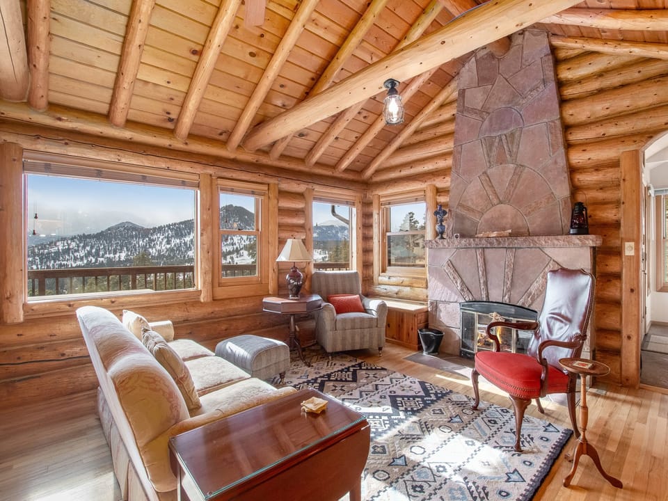Bishop's Retreat - Comfortable seating and expansive mountain views from the Roosevelt room. Fireplace is not operable.