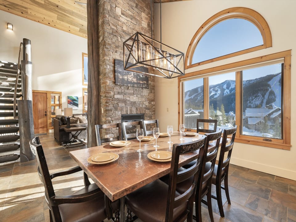 Large copper dining table with seating for 8 , with stunning views of the resort