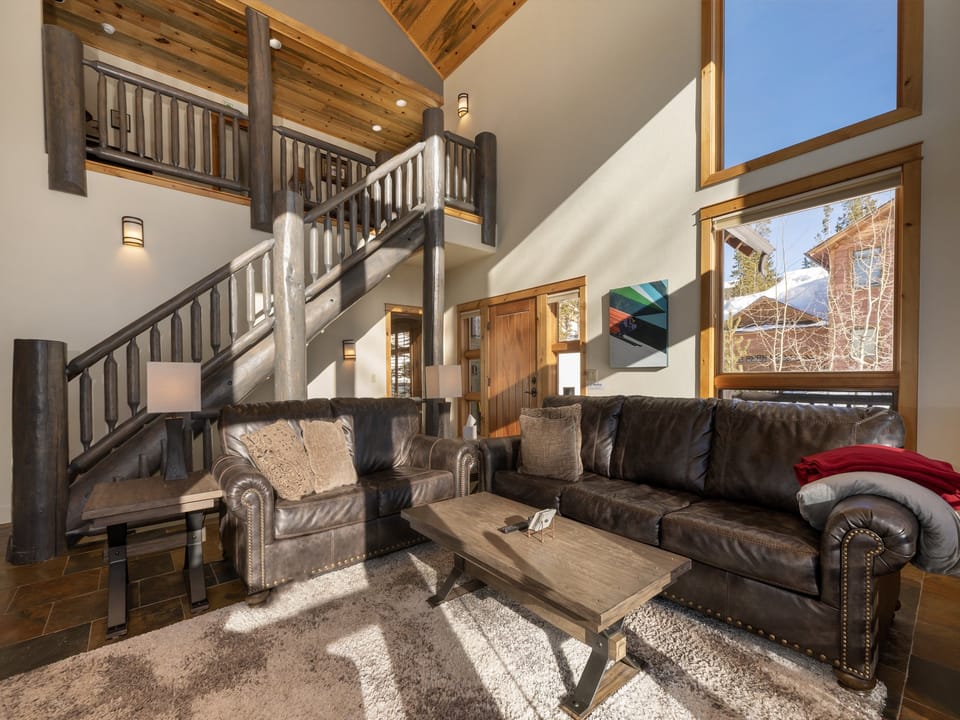 A cozy living room with large windows bathing the space in natural light