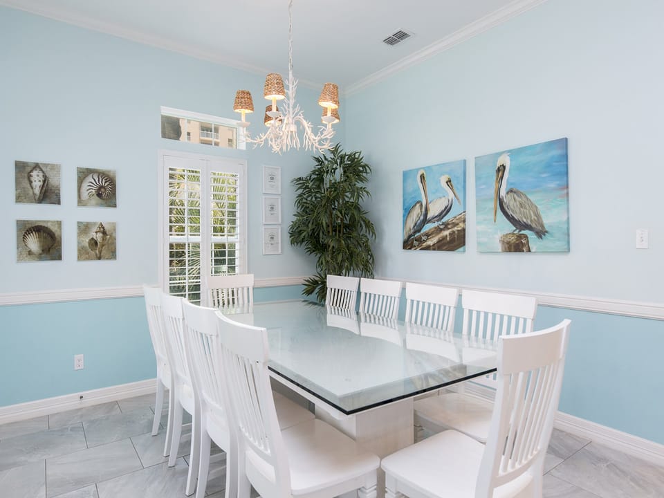 Beautiful dining room with large table (accommodates 10 guests. Additional seating at the bar & plenty of outdoor dining space as well!