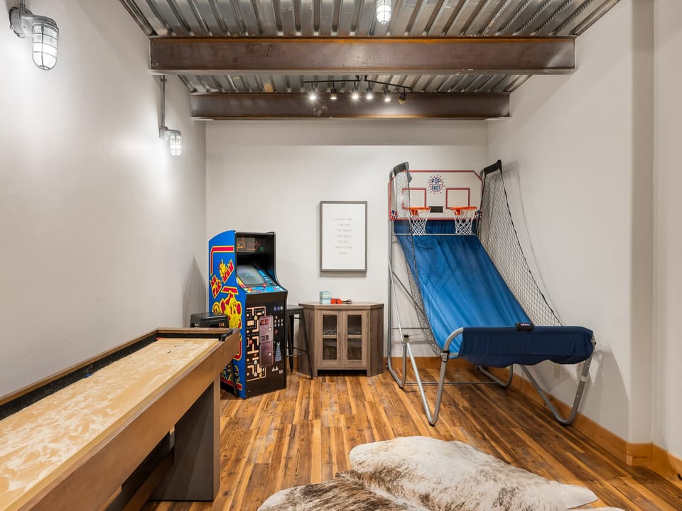 Enjoy Game room with BBall, Shuffleboard and packman and fooseball
