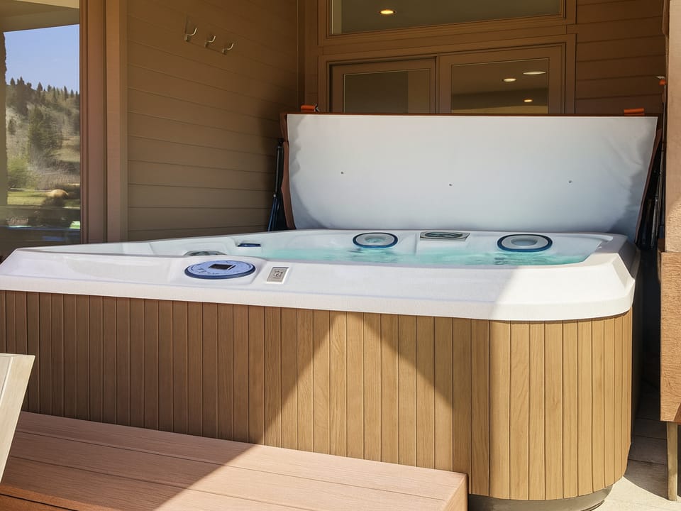 Unwind in your private hot tub with mountain views - the perfect spot to soak your muscles after a day of adventure
