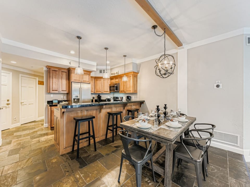 Gather around your beautiful open-plan kitchen and dining space, where modern appliances and warm wood cabinetry create the perfect setting for memorable meals together.