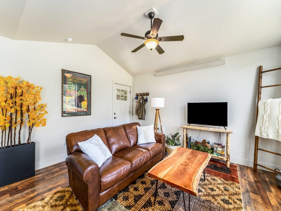 Serenity in the Rockies - Living area with a sofa and flat screen TV