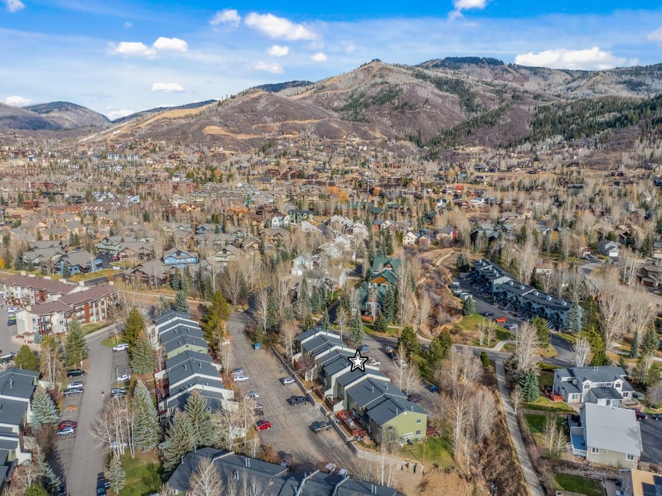 Wake up to breathtaking mountain views that stretch endlessly beyond your window. You'll love how this peaceful neighborhood nestles perfectly into the valley below those majestic peaks.