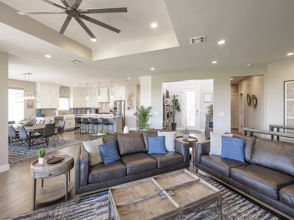 The Large Great Room includes an oversized dining table, gourmet kitchen, and the perfect seating area for relaxing and watching your favorite movie or tv program.