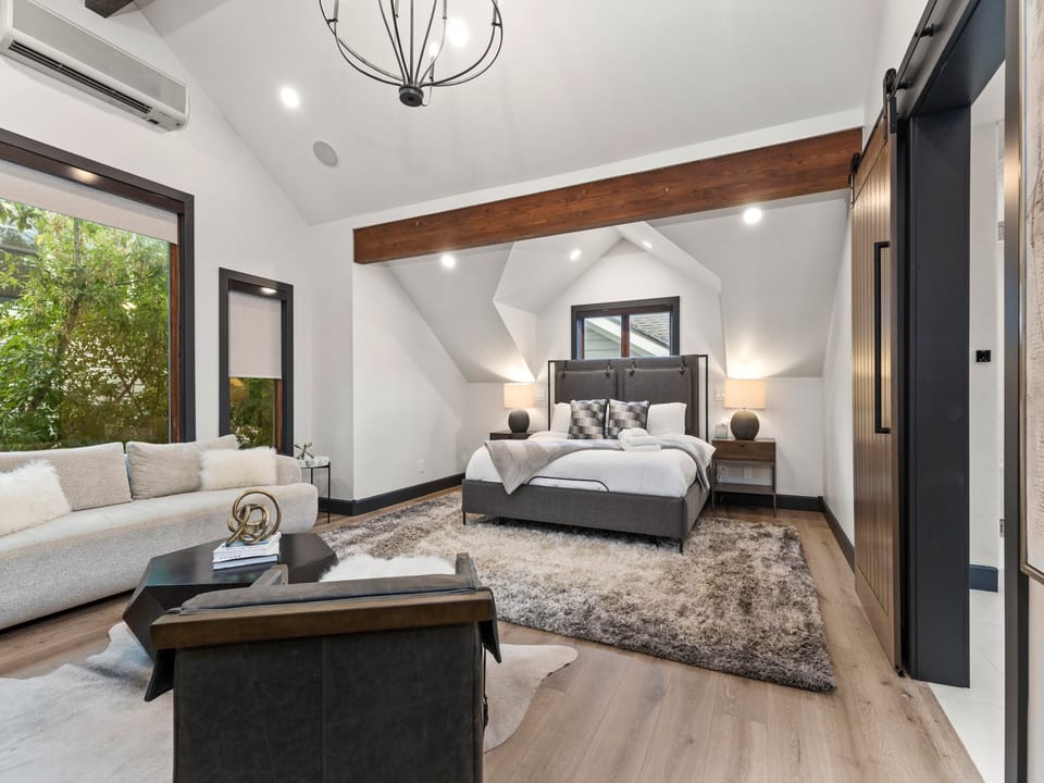 King Primary Bedroom with Ensuite, fireplace, and Smart TV